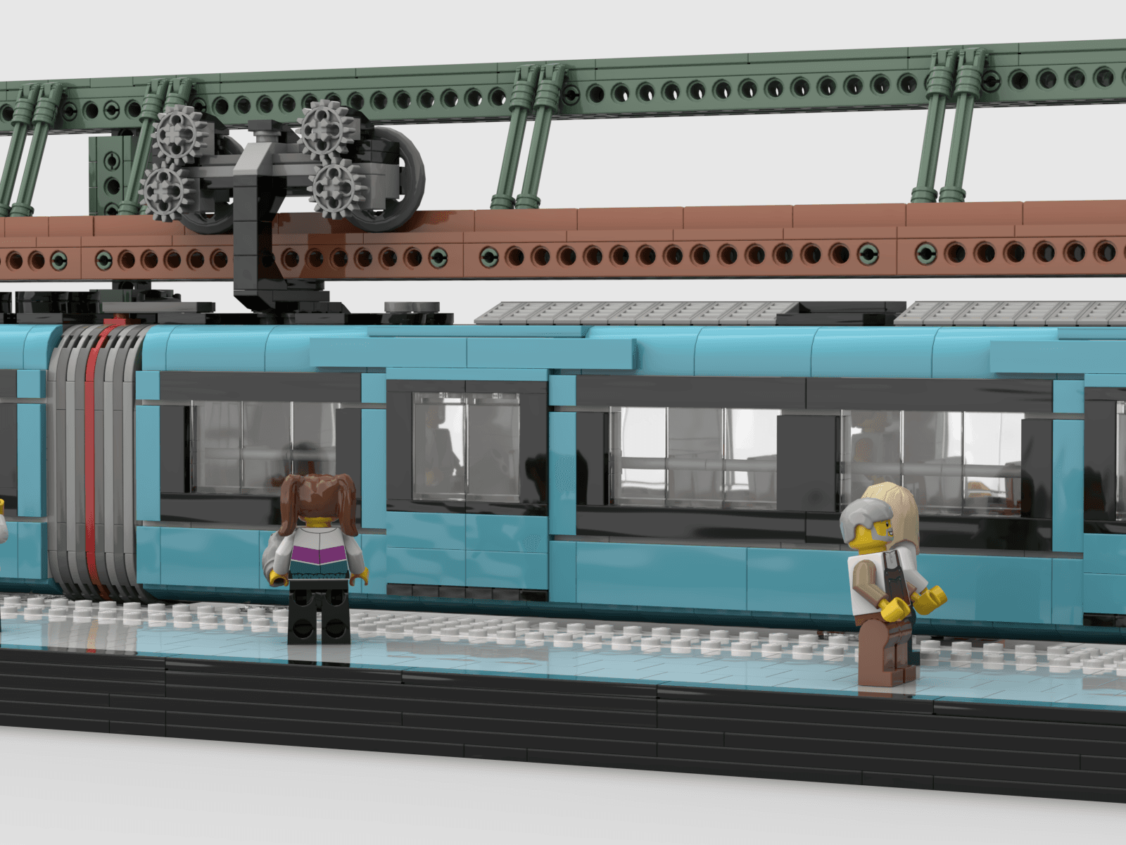 Nahe Seitenaufnahme des Klemmbausteinmodells der Schwebebahn mit Figuren am Bahnsteigrand
