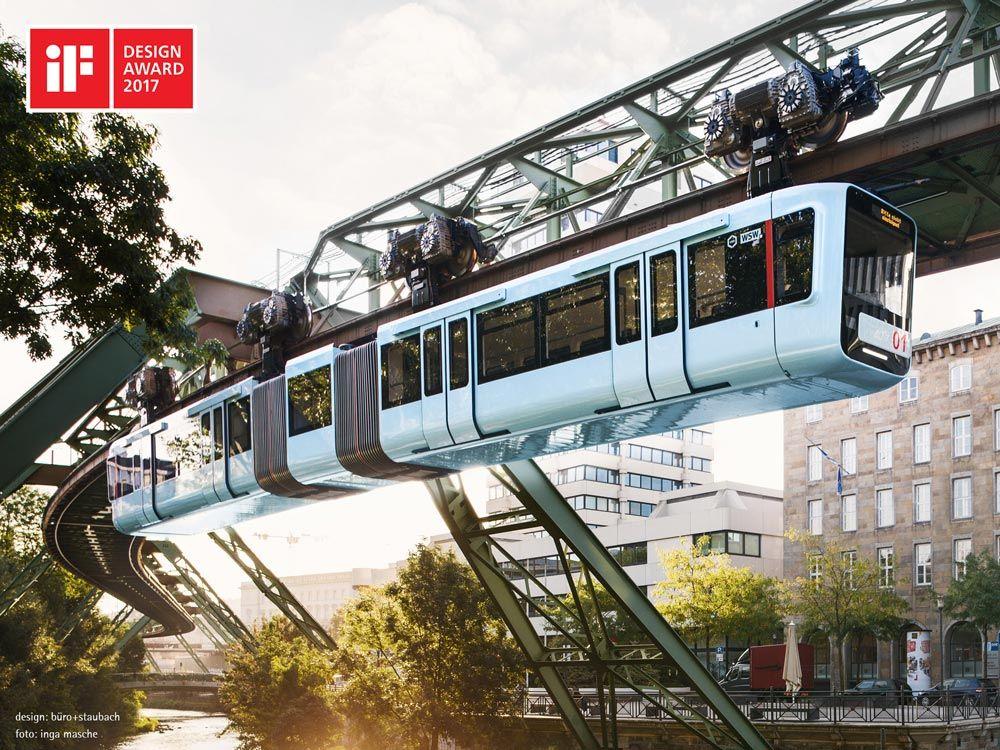 Die neue Schwebebahn fährt durch ein malerisches Wuppertal